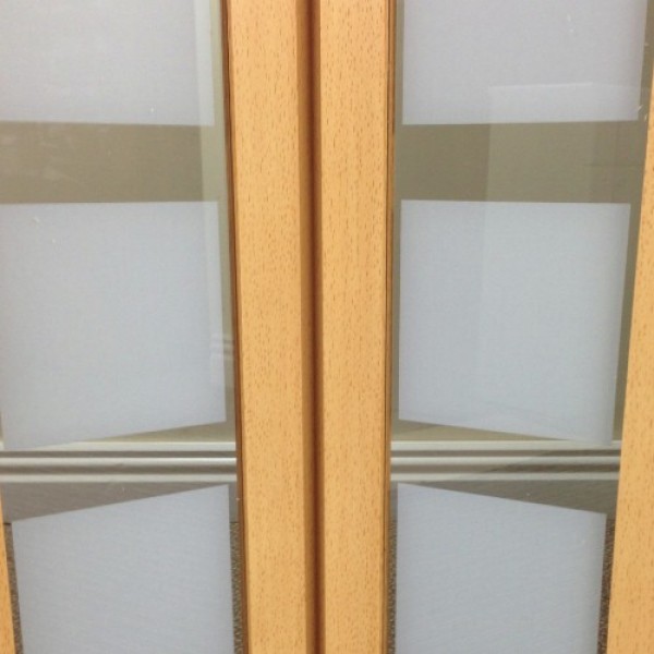 The New Generation Internal Folding Concertina Door Beech Effect Glass